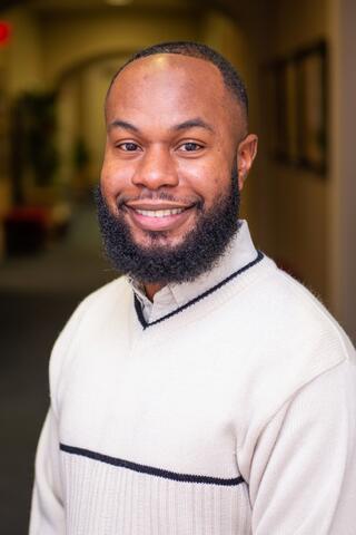 A happy man smiling about rural research
