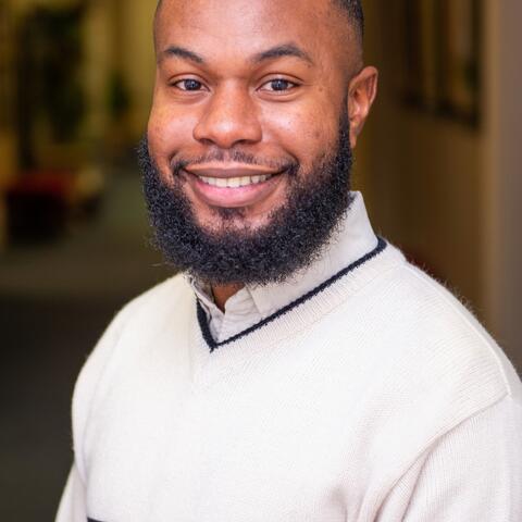 A happy man smiling about rural research