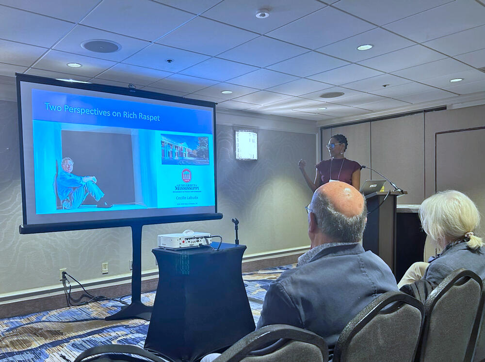 A scientist giving a talk at a conference